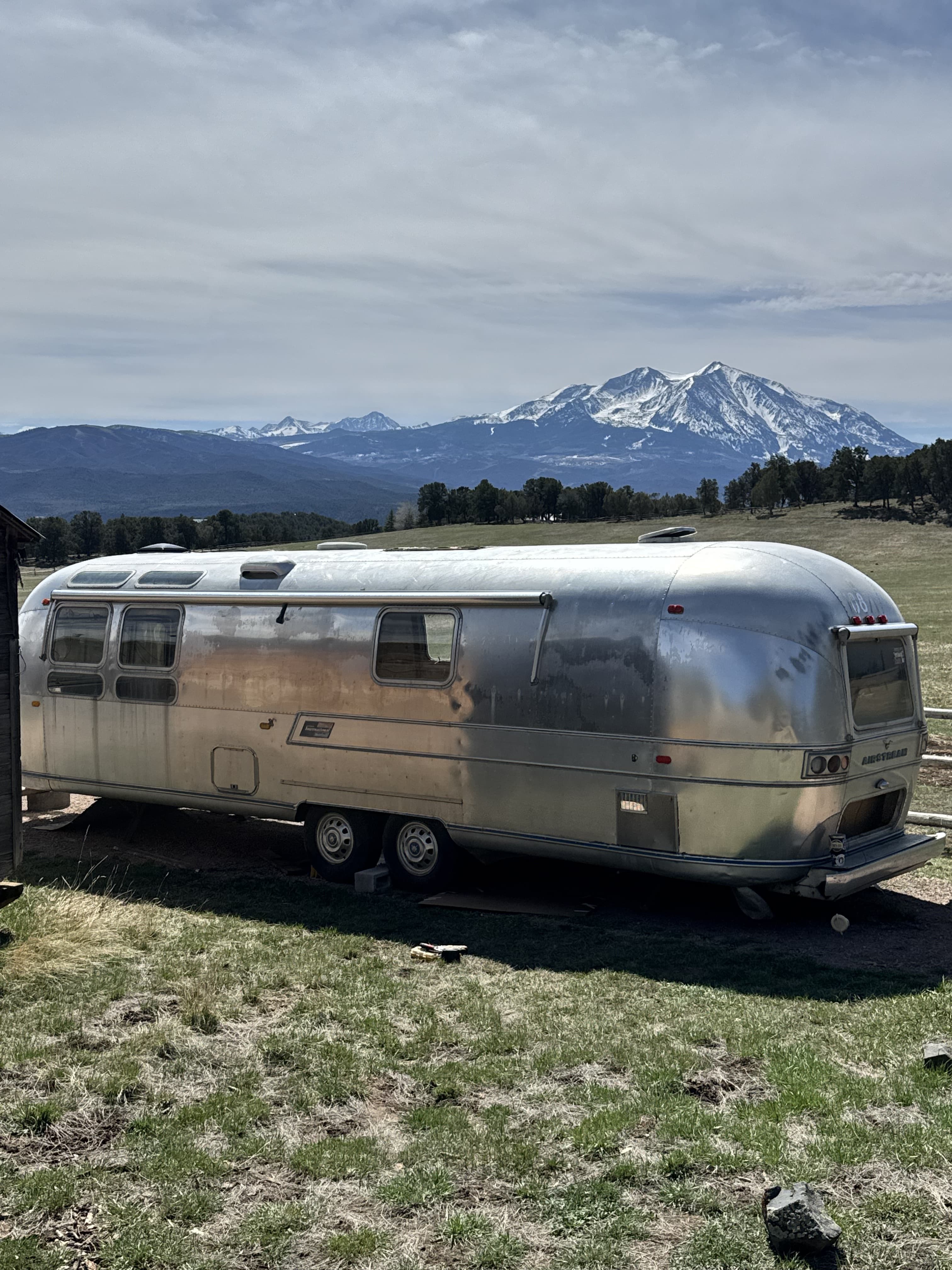 A polished Airstream trailer in a mountain meadow near Minturn, Colorado.